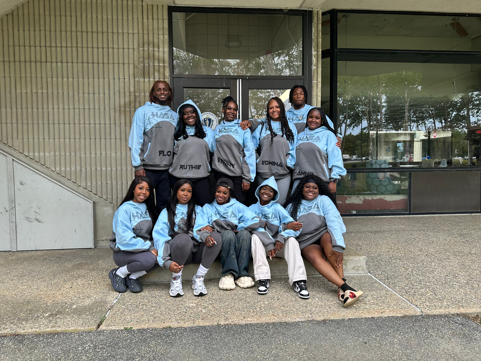 Group wearing custom HASA 1804 blue and grey hoodies